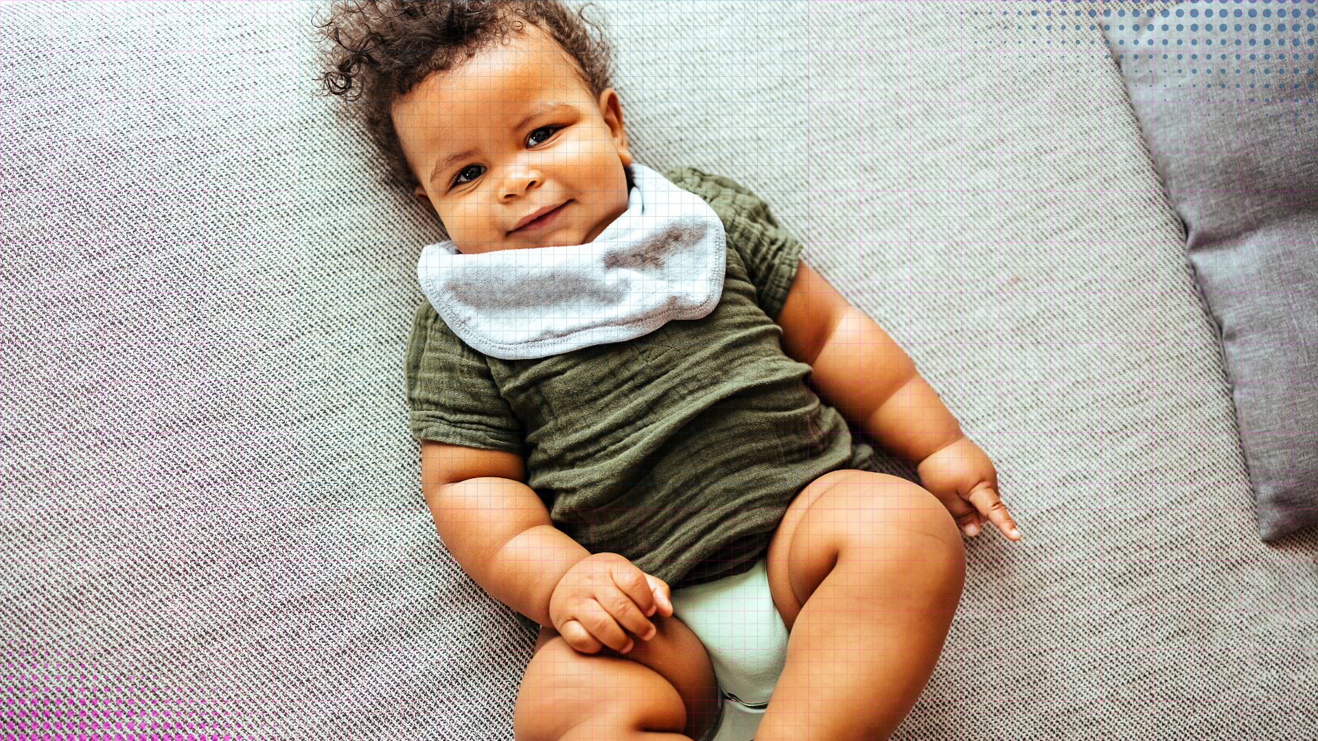 A happy baby exploring and reaching a new milestone